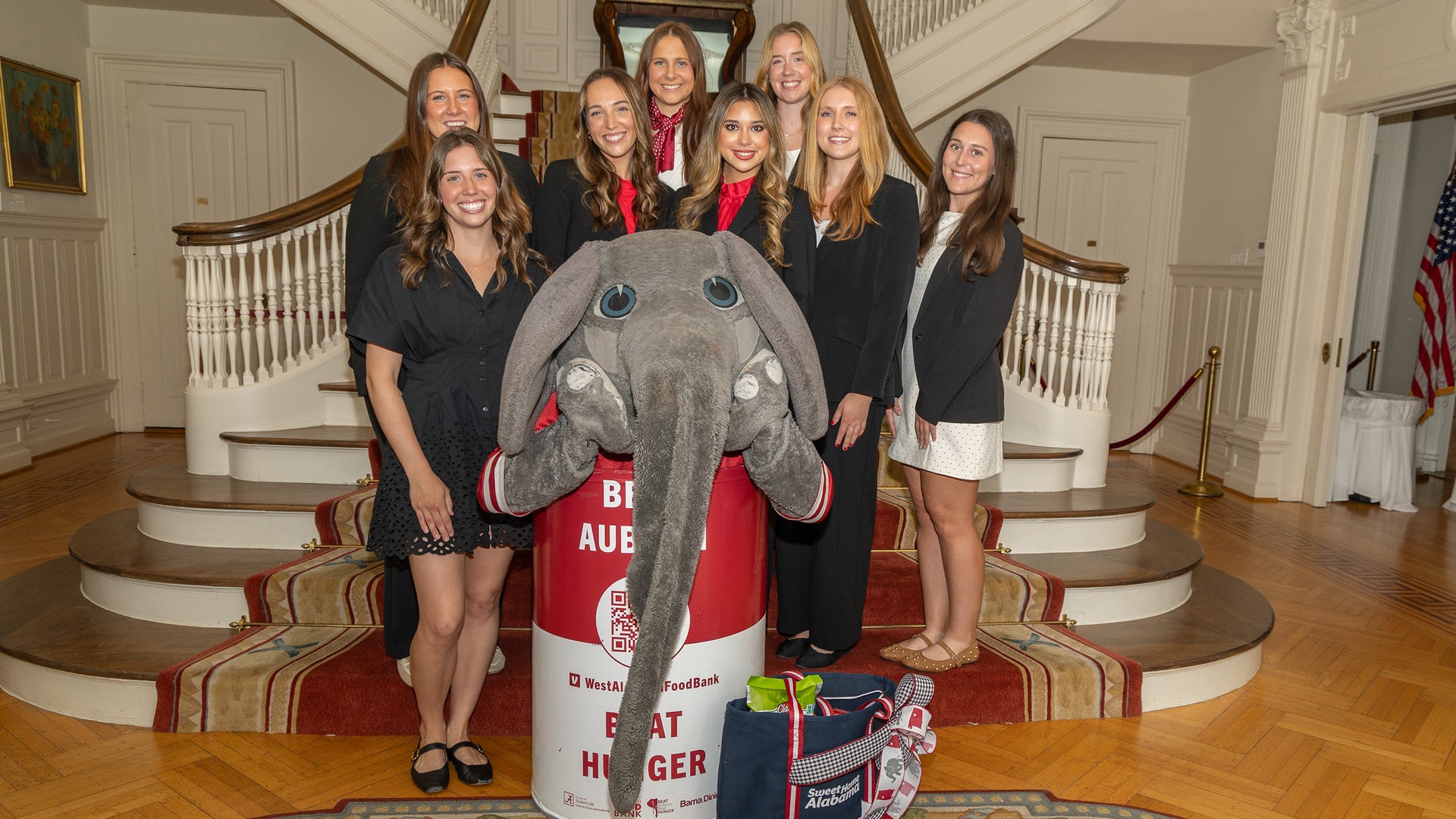 Beat Auburn Beat Hunger representatives and Big Al pose in the Alabama Governor's Mansion