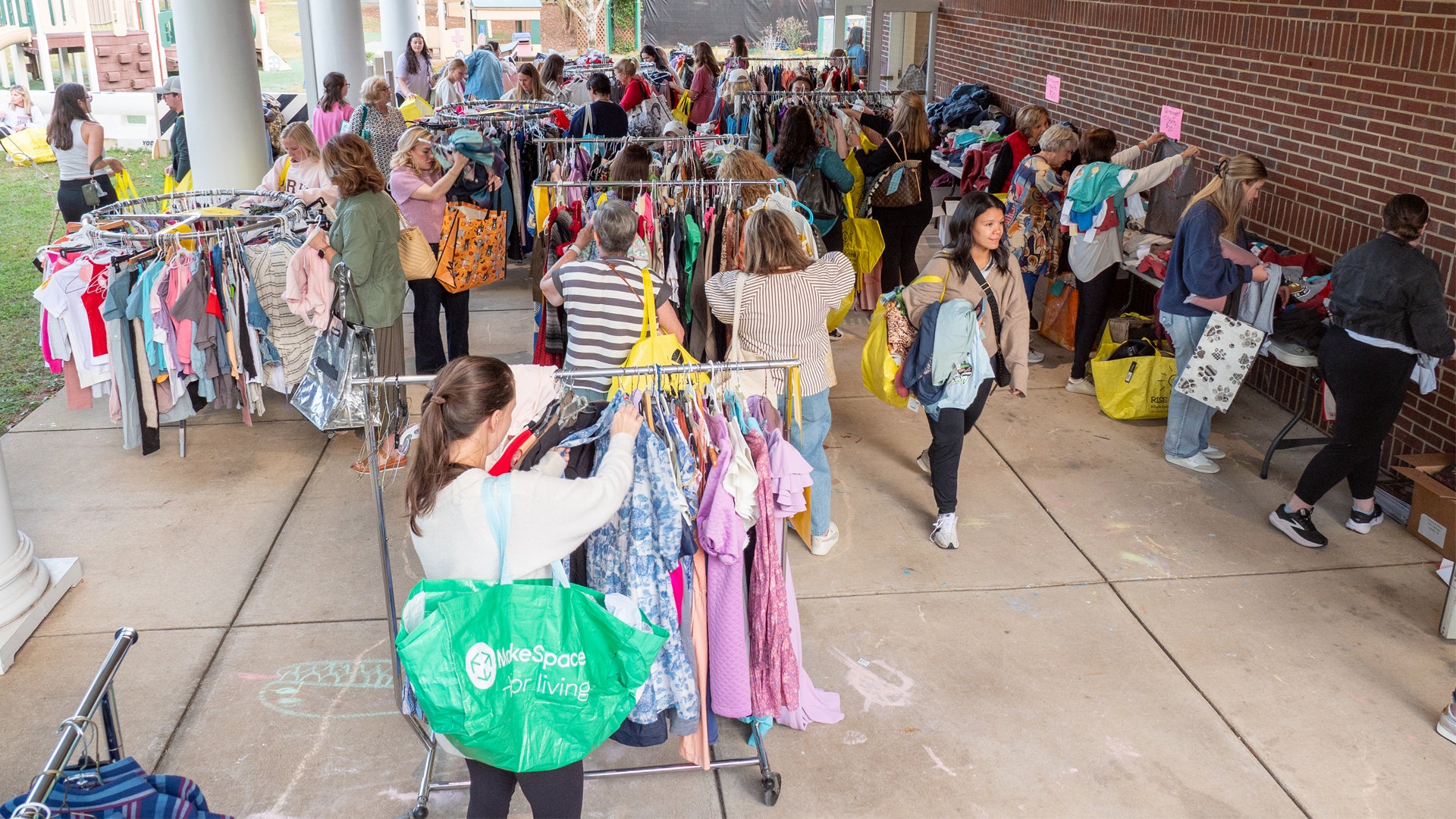 Shoppers looking through racks of clothing at last year's BUY for RISE